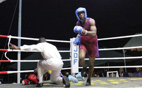 Sapper Donald Patrick of 1 Engineer Regiment (JDF) celebrates in the ring after knocking down his opponent Private Coran Chambers from the First Battalion Jamaica Regiment